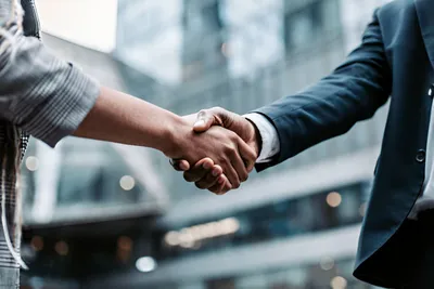 Business men shaking hands to initiate a project